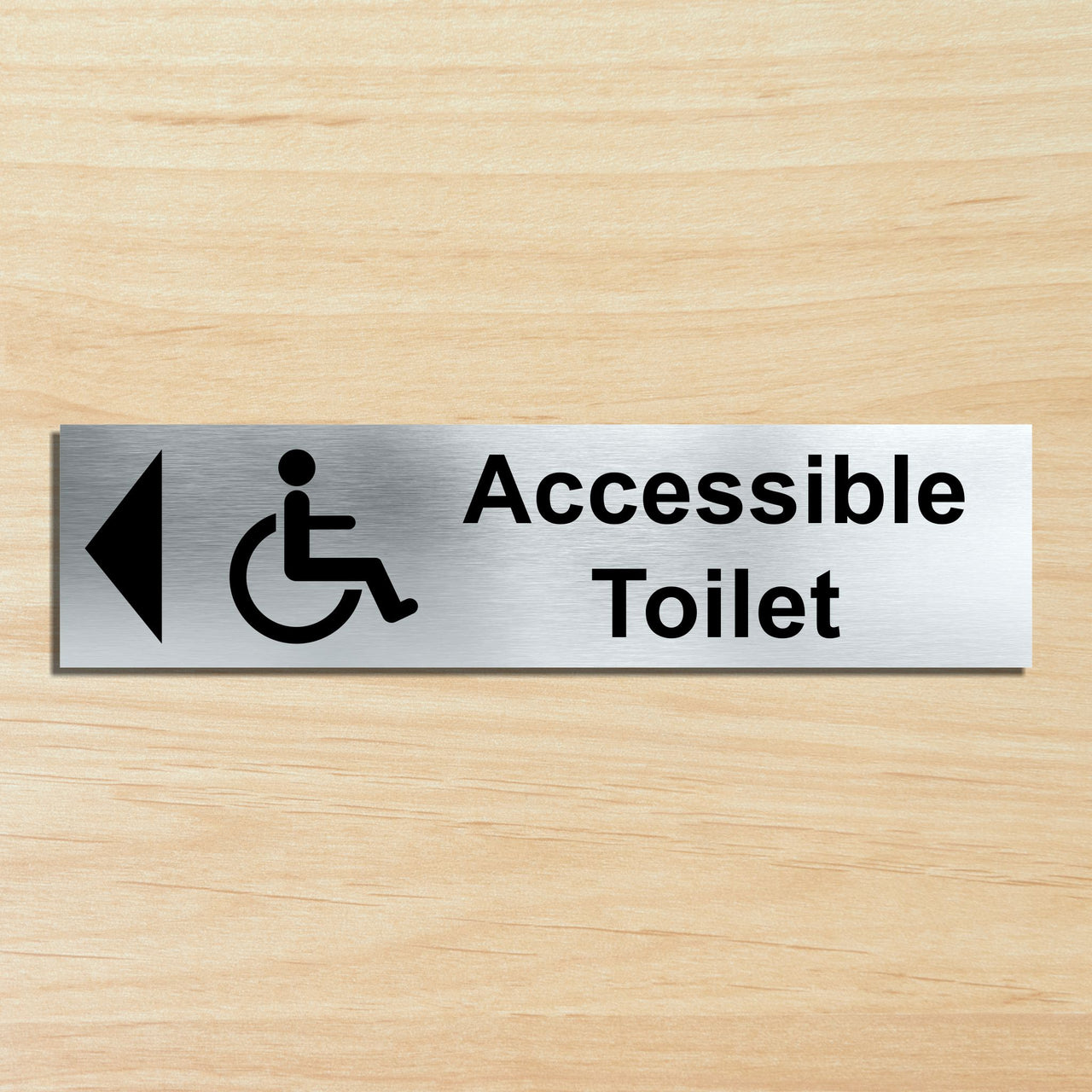 Accessible Toilet Door Sign with a Left Pointing Directional Arrow