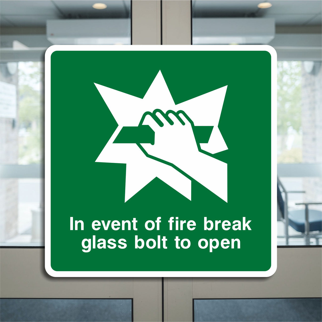 In Event of Fire Break Glass Bolt to Open Sign