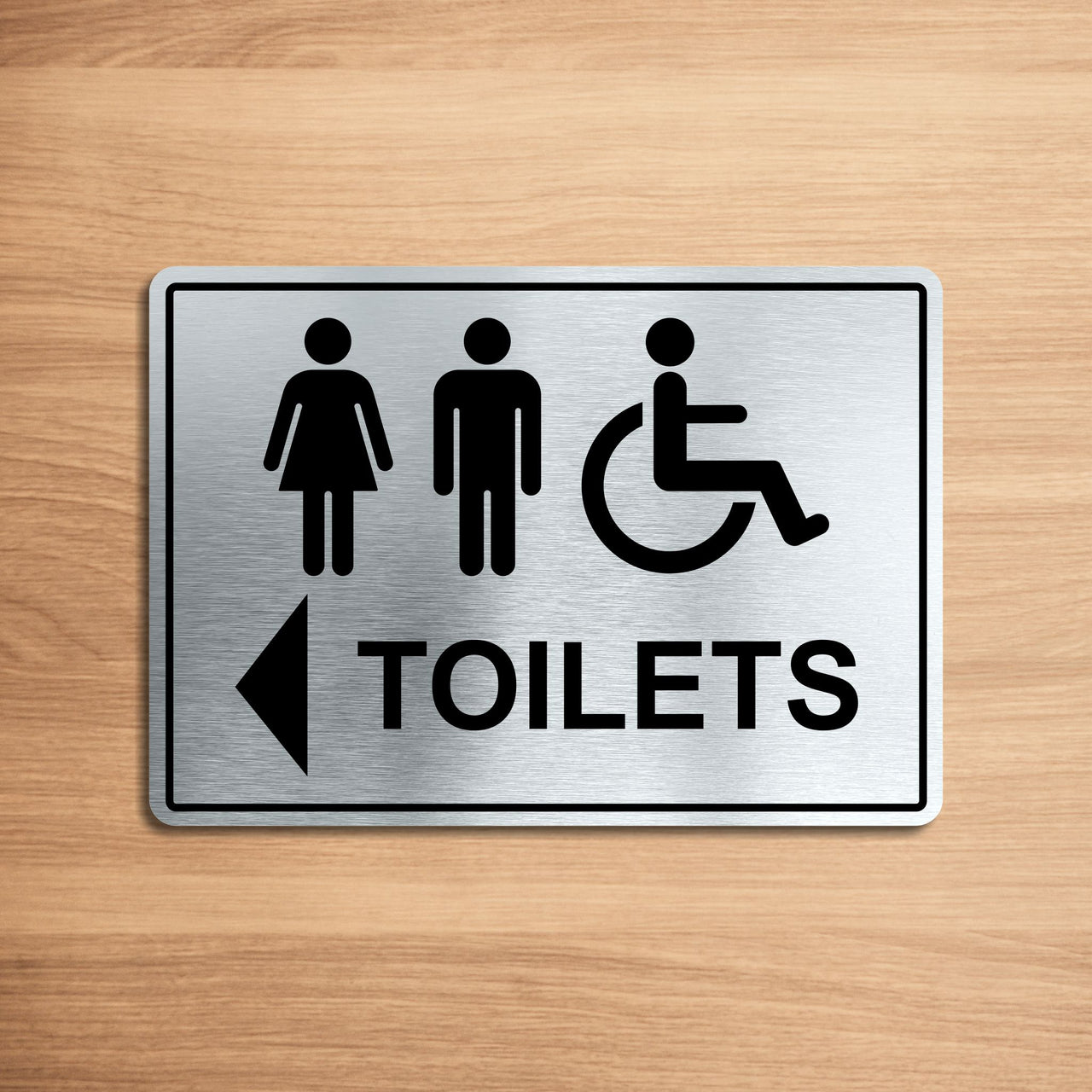 Accessible Toilets Sign with a Left Pointing Directional Arrow