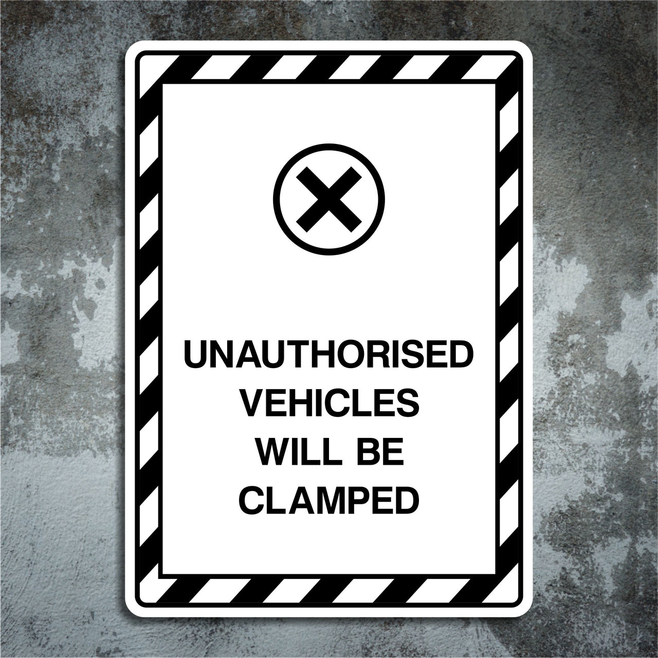 Unauthorised Vehicles Will Be Clamped Sign