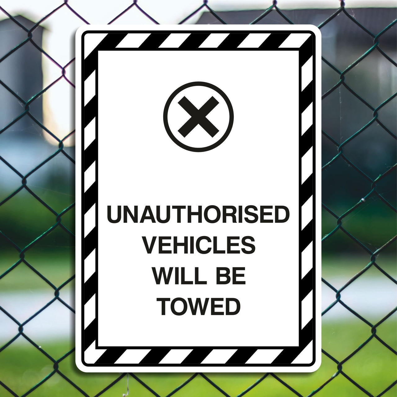 Unauthorised Vehicles Will Be Towed Sign