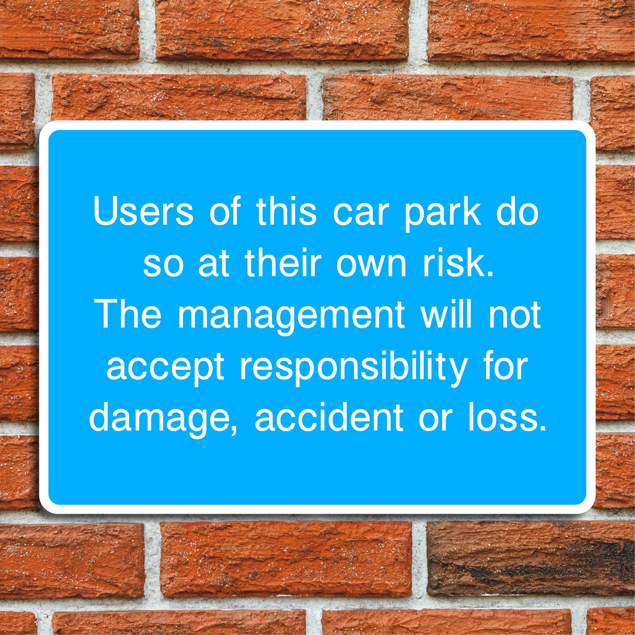 Users of This Car Park Do So At Their Own Risk Sign