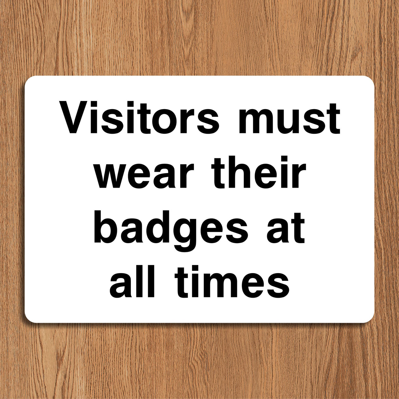 Visitors Must Wear Badges At All Times Sign
